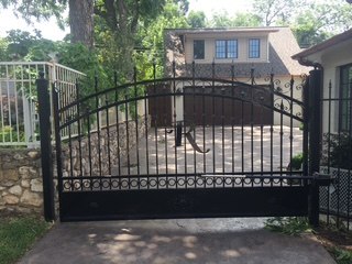 Custom iron driveway gate with monogram Fort Worth